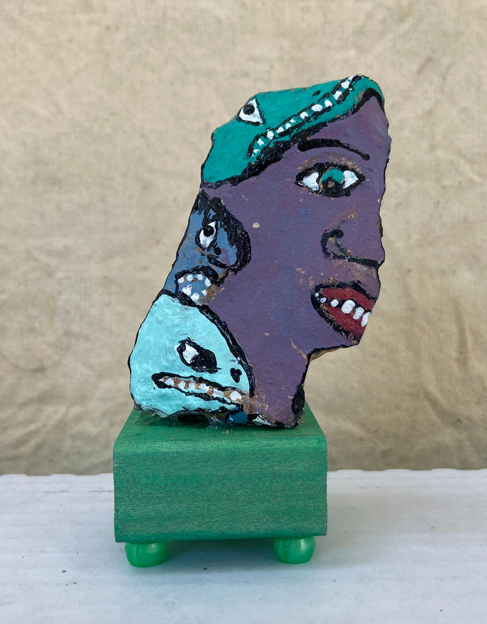 14 Faces on a Rock